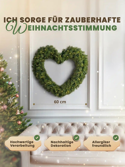 Couronne de Noël artificielle en forme de cœur de 60 cm, de ArtiTree, avec indication de la dimension, sur un mur blanc